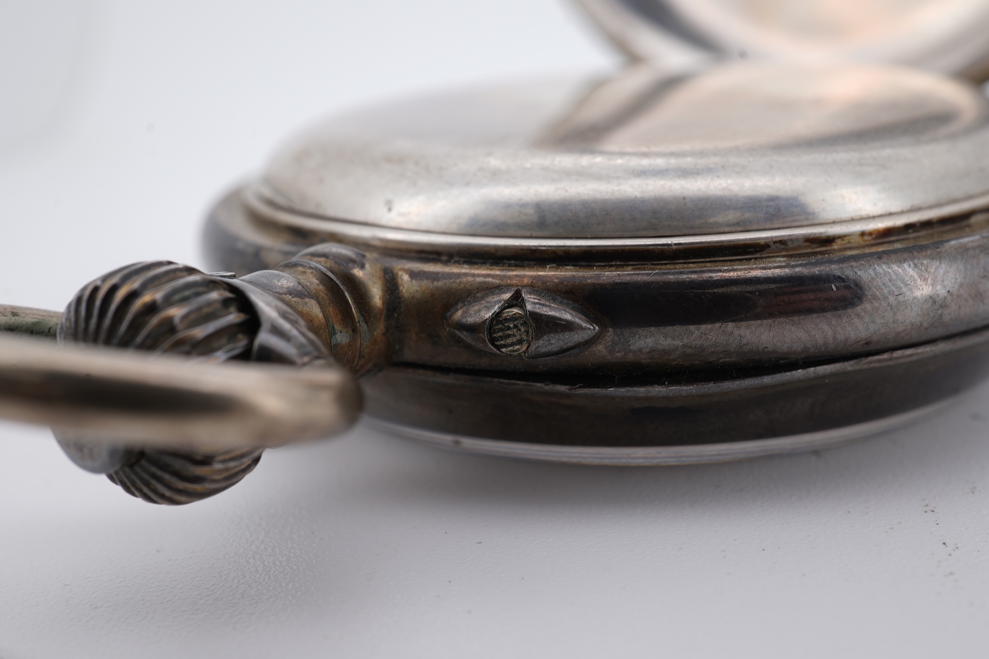An early 20th century continental 800 standard white metal open faced chronograph pocket watch, with Roman numerals and two subsidiary dials, case diameter 50mm, together with a similar smaller white metal open faced poc